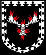 Sable, a moose's head erased affronty argent enflamed gules within a bordure dovetailed argent pellety.